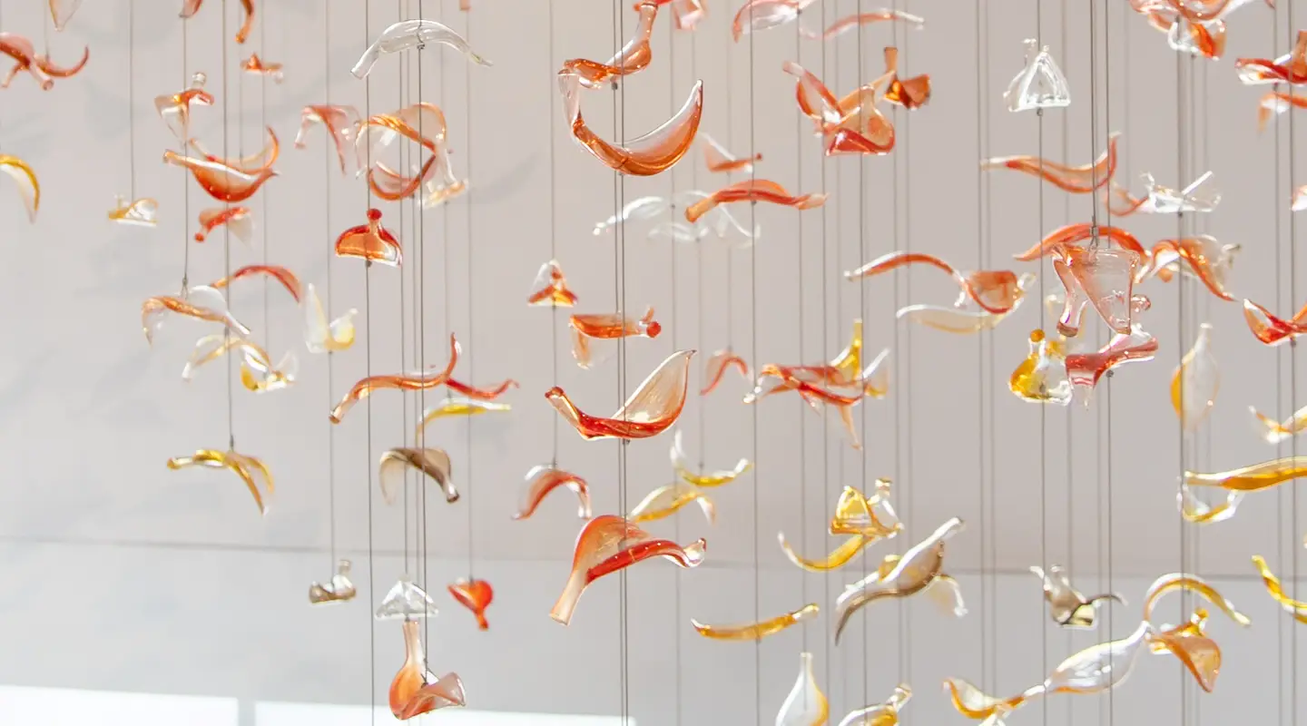 Glass leaves suspended in the stairwell