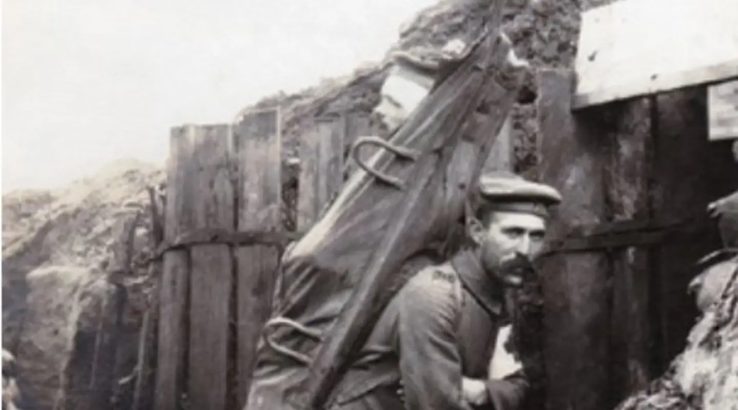 A German stretcher bearer carrying a patient to an Aid Post. 