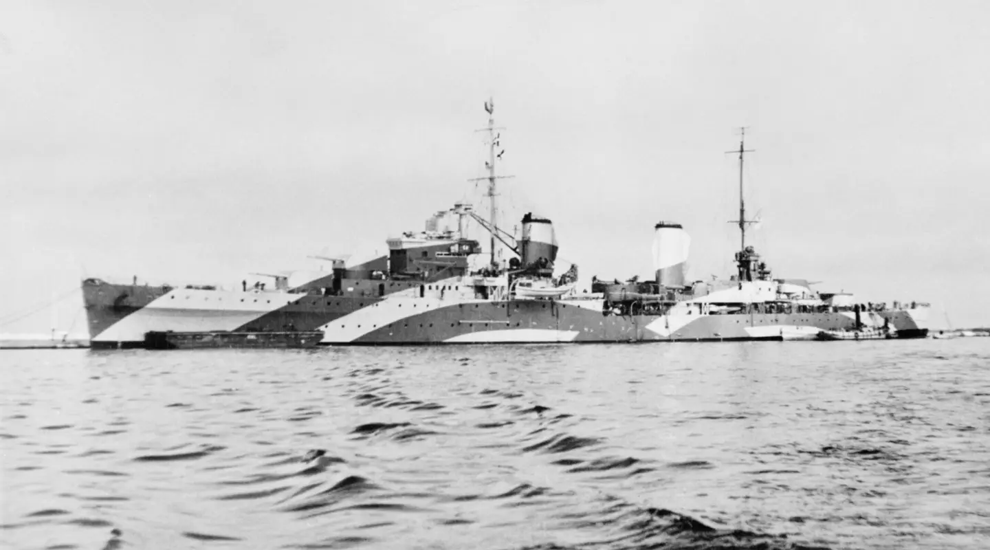 HMAS Perth at sea in a camouflage scheme. 
