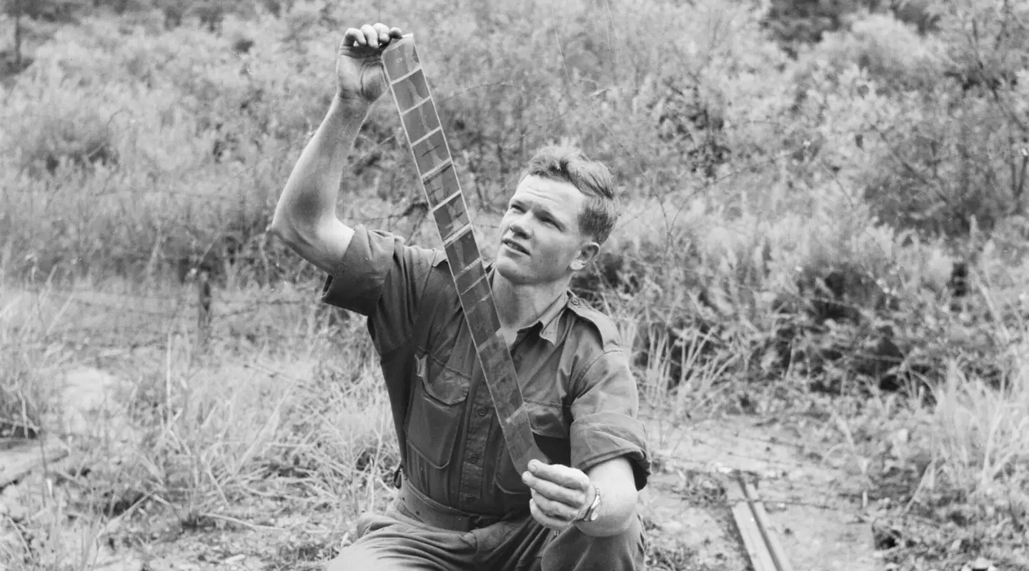 Private John ‘Dogger’ Dick examining his negatives