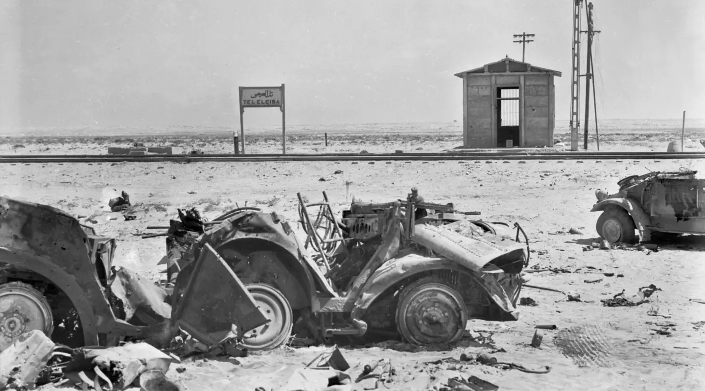 A VIEW OF THE RAILWAY STATION AT TEL ELEISA, SCENE OF SOME OF THE MOST INTENSIVE FIGHTING EXPERIENCED BY OUR FORCES AT PRESENT ENGAGED IN THE WESTERN DESERT. TEL EL EISA IS THE ARABIC FOR "HILL OF JESUS". (NEGATIVE BY HURLEY).