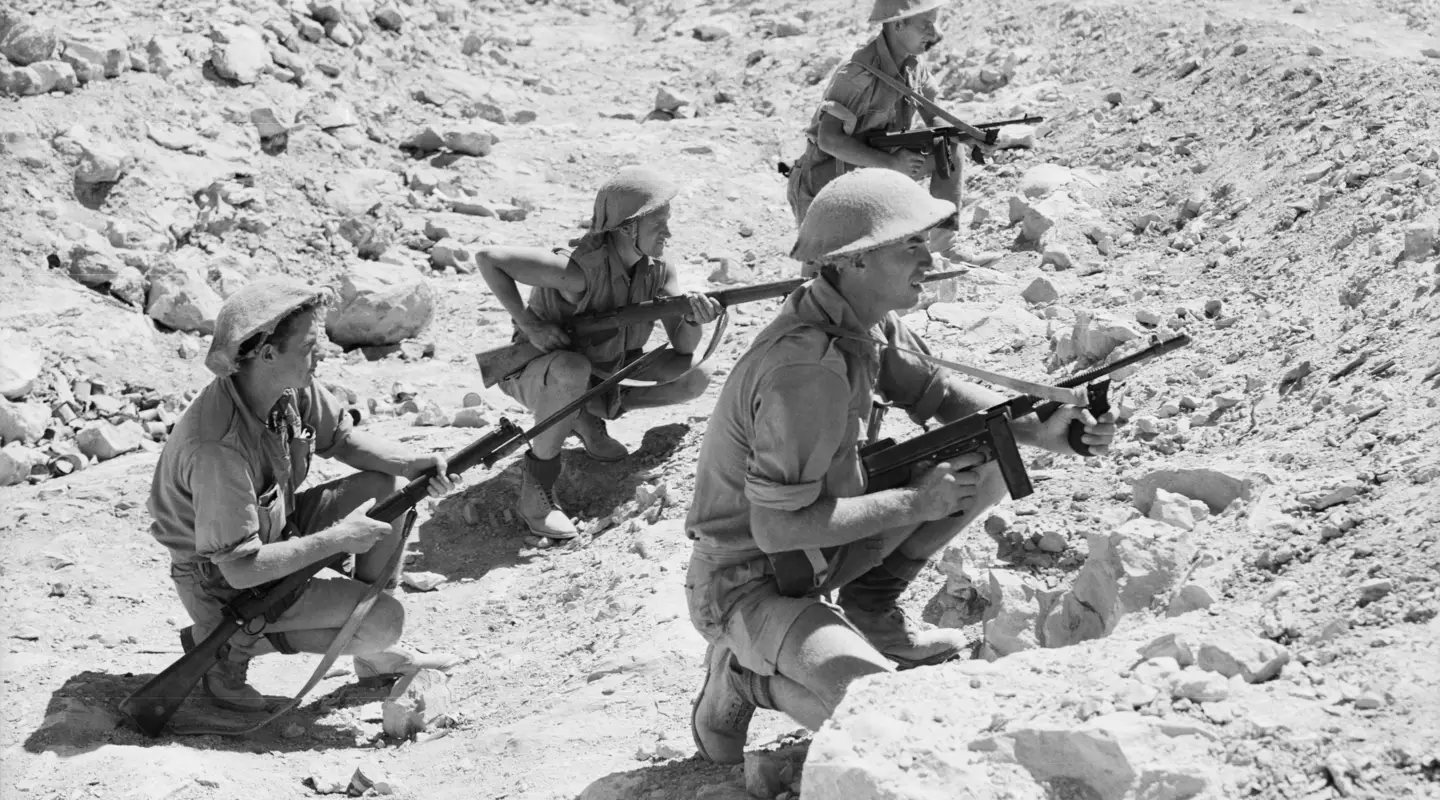 An Australian patrol lays up in an anti-tank ditch near the perimeter of the Australian defences around Tobruk  
