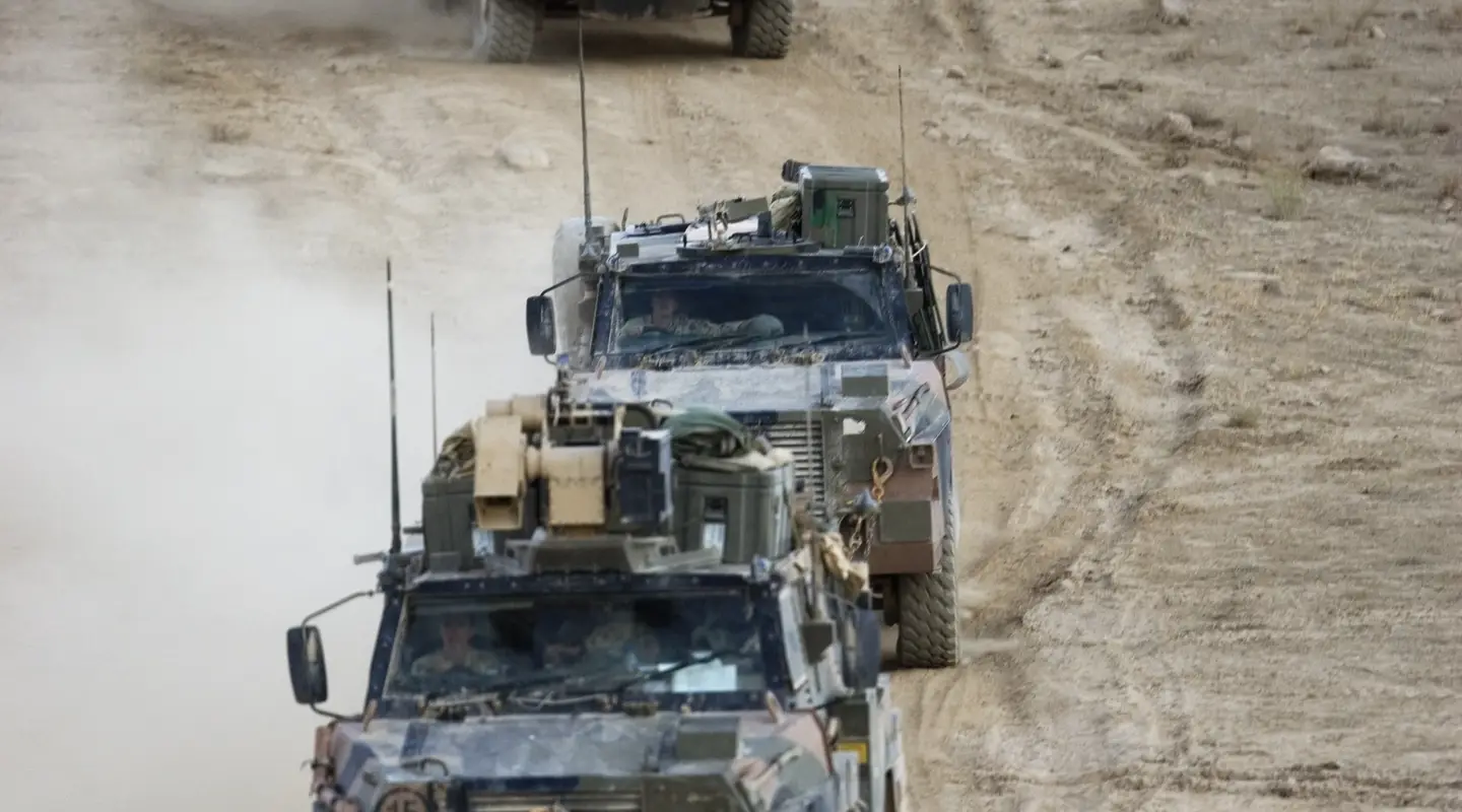 A convoy of Bushmasters of the 3RAR depart the Tarin Kowt Range
