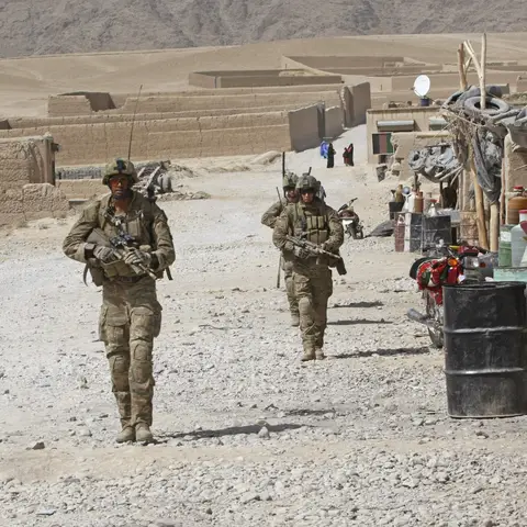 Australian and Afghan National Army (ANA) soldiers enter the Shahadi-E-Hasas district centre.