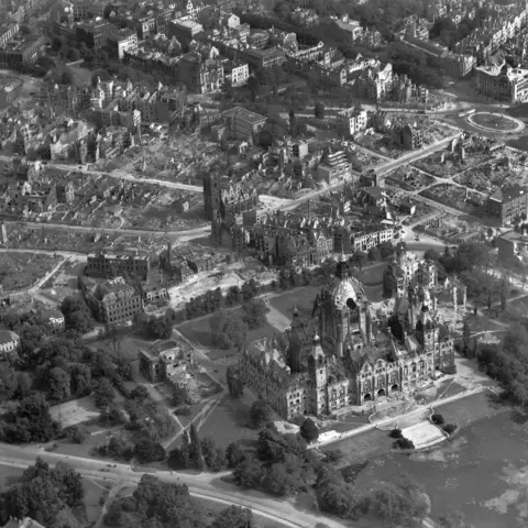 Aerial photograph of an area of Berlin showing the extensive damage caused by allied bombing. The large building in the foreground is the Charlottenburg Palace.