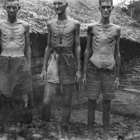 Three workers at Shimo Songkurai No. 1 Camp. 