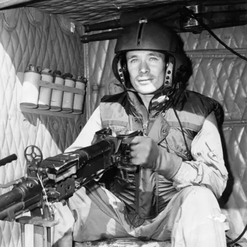 Neville Sinkinson sits in a helicopter during the early 1970s