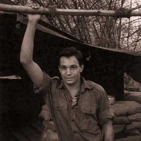 Frank Clarke stands outside in his uniform
