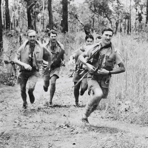 Members of an RAAF Spitfire Squadron race to their planes to intercept Japanese raiders
