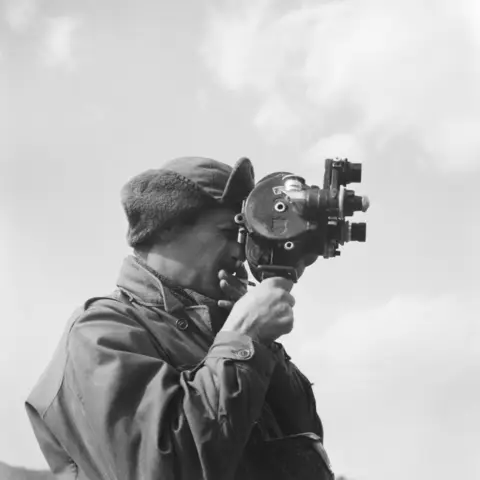 An unidentified member of 3RAR using a cinecamera