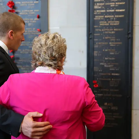 Lance Corporal Todd Chidgey's mother Kerry Baker and brother Adam Chidgey at the Roll of Honour at the Australian War Memorial