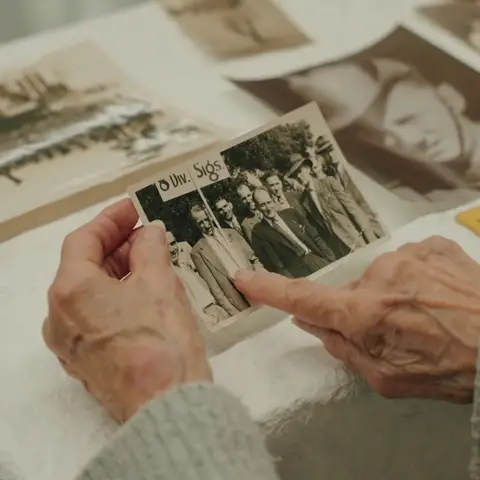 Rae Maree Curtis points out her uncle in a photograph.