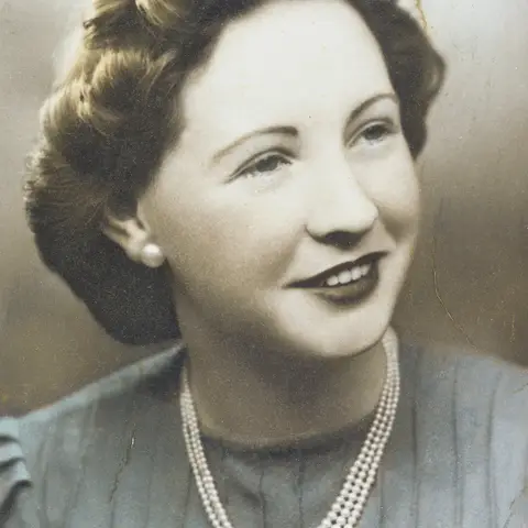 Studio portrait of Irene Simper on her wedding day.