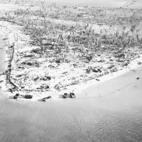 The clearing in the centre of the islet is the airfield. Photo credit NH 95704 US Naval History and Heritage Command Collection
