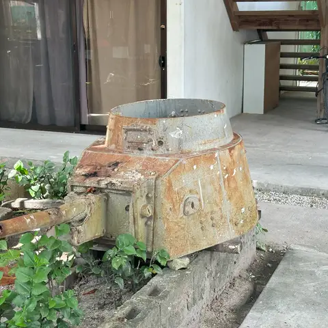 A Ha-Go tank turret in the courtyard of one of Tarawa’s few hotels, Betio Lodge. Photo credit Emily Hyles