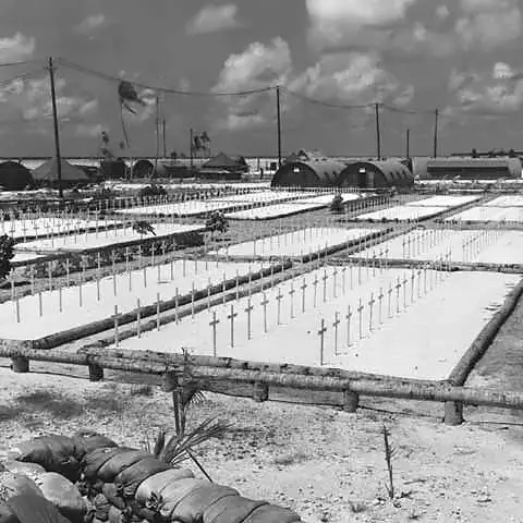 11.	US Navy built Quonset huts surround a burial ground in early 1944. Photo credit Marine Corps 22-17, Julian W. Moody
