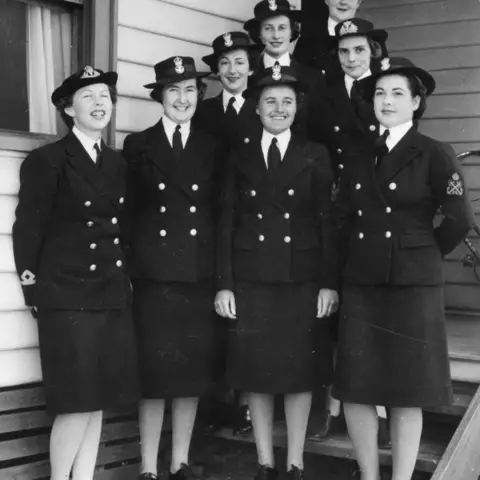 Outdoor group portrait of some of the first members of the WRANS.