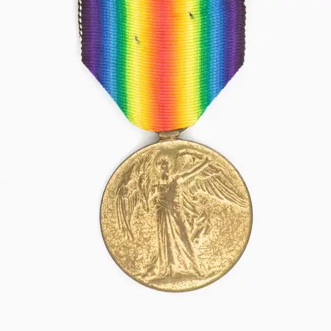 The British Empire Victory Medal, showing the Winged Victory, issued to all military personnel who served in the war between 5 August 1914 and 11 November 1918