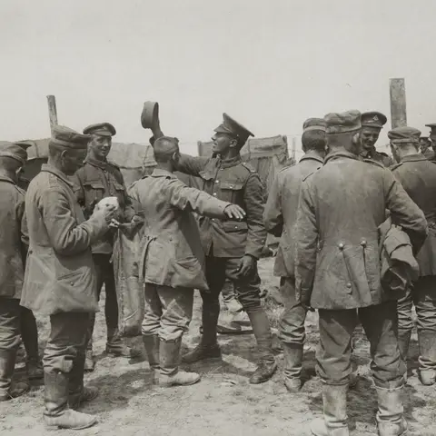 Captured German soldiers being searched early in the Somme campaign