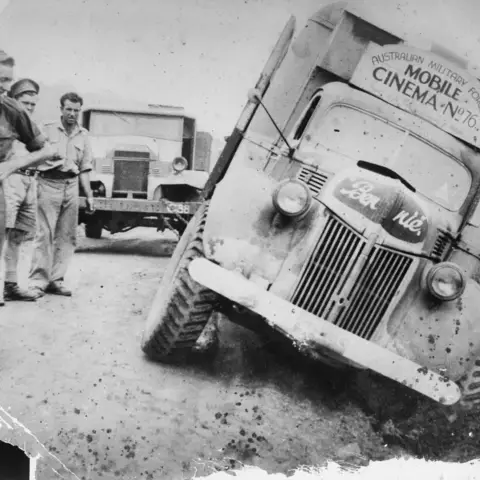 Ford truck “Bennie” of Mobile Cinema Unit 76 bogged near Port Moresby, New Guinea, 1942
