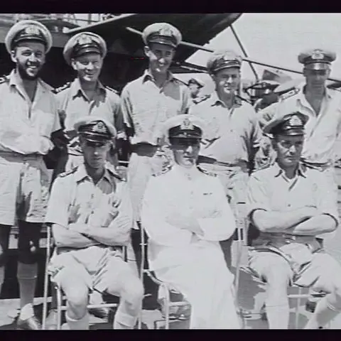 Commander Maurice Rose (front, centre) and officers of HMAS Diamantina following the surrender ceremony