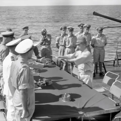 Brigadier John Stevenson (obscured, centre) receives Captain Hisayuki Soeda’s sword, prior to the surrender of Nauru