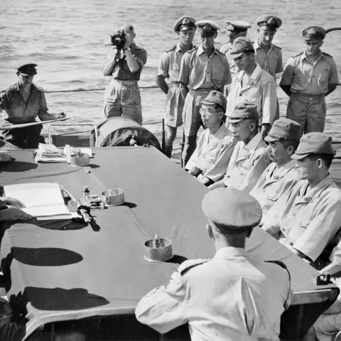 Brigadier John Stevenson reads the terms of surrender to Captain Hisayuki Soeda before the Japanese surrender of Nauru