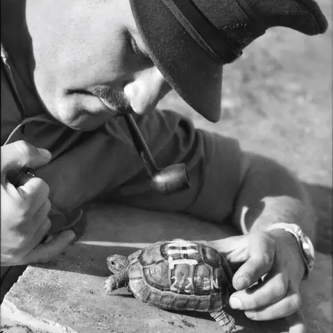 Captain D. Michelson with a Tortoise named "Tim", the mascot of the 2/2nd Battalion.