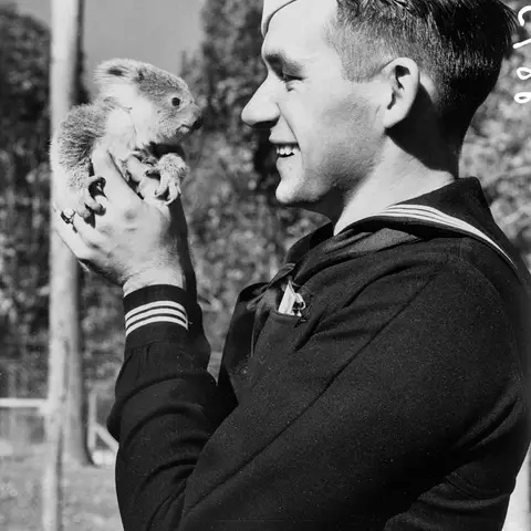 Arthur Mercer, from the USS Salt Lake City, and Rata, a baby koala.