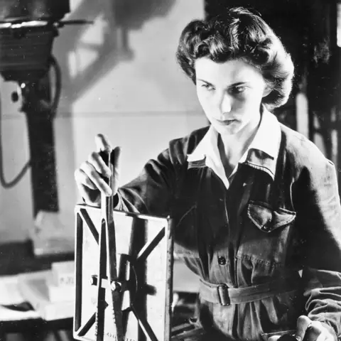 WAAAF photographer making contact prints from developed aerial film