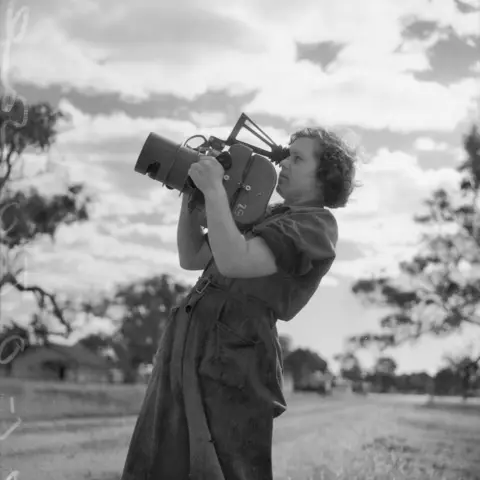 Testing an aerial camera after it has been overhauled in the workshop of No. 1 Operational Training Unit, RAAF.