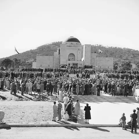 Onlookers line the front entrance of the Australian War Memorial at the ceremony for the building's opening in 1941.