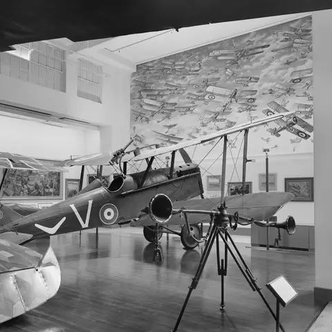 A view of Aeroplane Hall showing an S.E.5A Aircraft in the foreground and a section of the Mural of Australian Military Aircraft.