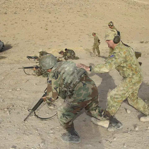 A member of MTF-3 teaching an Afghan National Army soldier