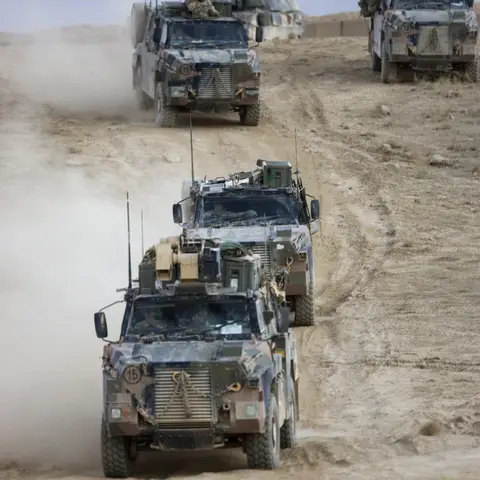 A convoy of Bushmasters of the 3RAR depart the Tarin Kowt Range
