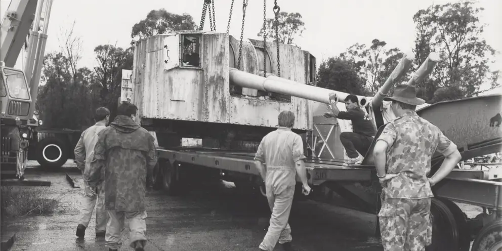 One of Arunta's 4.7 inch gun being loaded for transport to the Memorial.