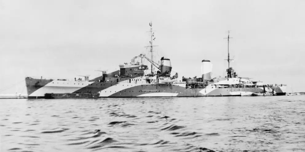 HMAS Perth at sea in a camouflage scheme. 