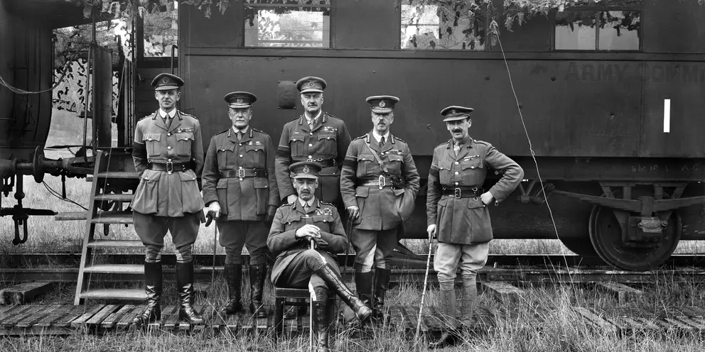 General Sir Henry Rawlinson with his senior Staff Officer (all unidentified) in front of Fourth Army Advanced Headquarters, a camouflaged railway train, at Montigny Farm, near Peronne.