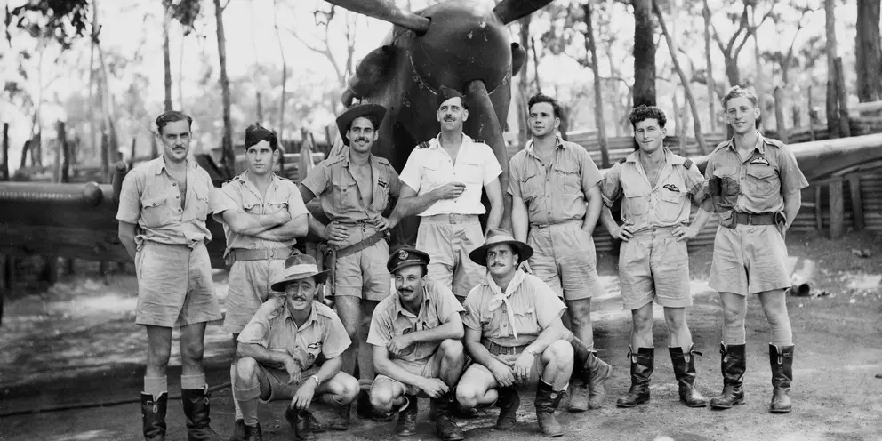 Group portrait of pilots of No. 452 Squadron RAAF in front of one of the Squadron's aircraft.