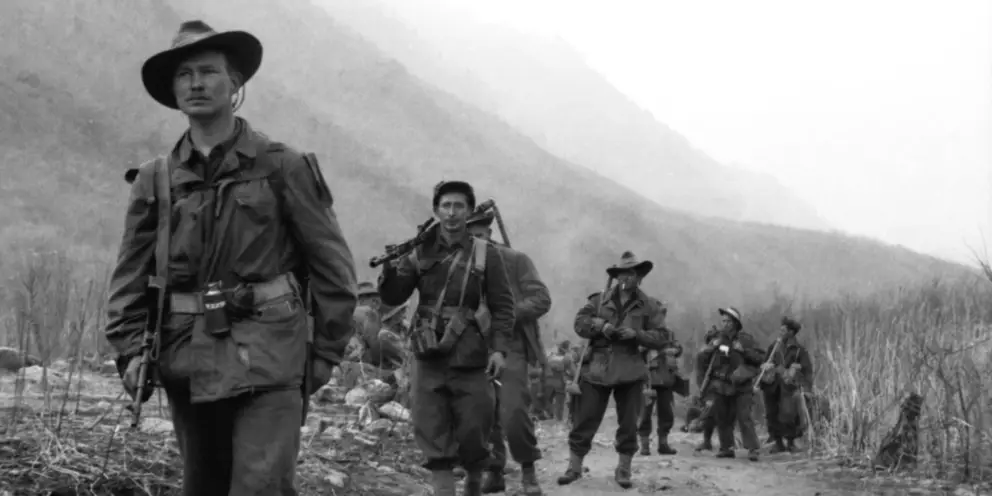 Members of C Company, 3RAR move forward from Hill 614 to attack Hill 587.