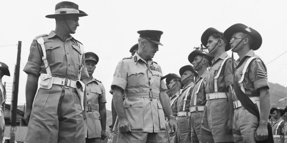 A Guard of Honour from the 67th Battalion, formed up at the Railway Station for Lieutenant General H C H Robertson CBE DSO, Commander-in-Chief BCOF in Japan.