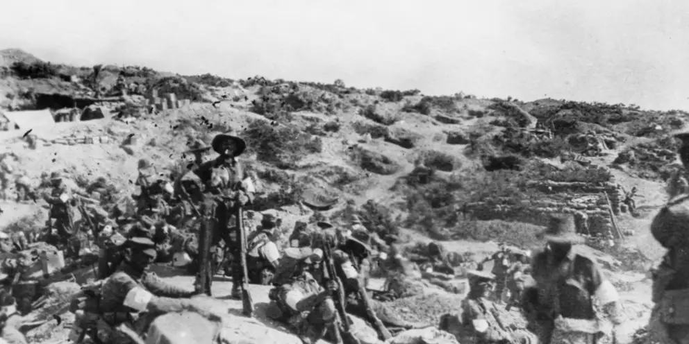 Men of the 3rd Battalion waiting below front line trenches on 6 August 1915, before commencing their assault on Lone Pine