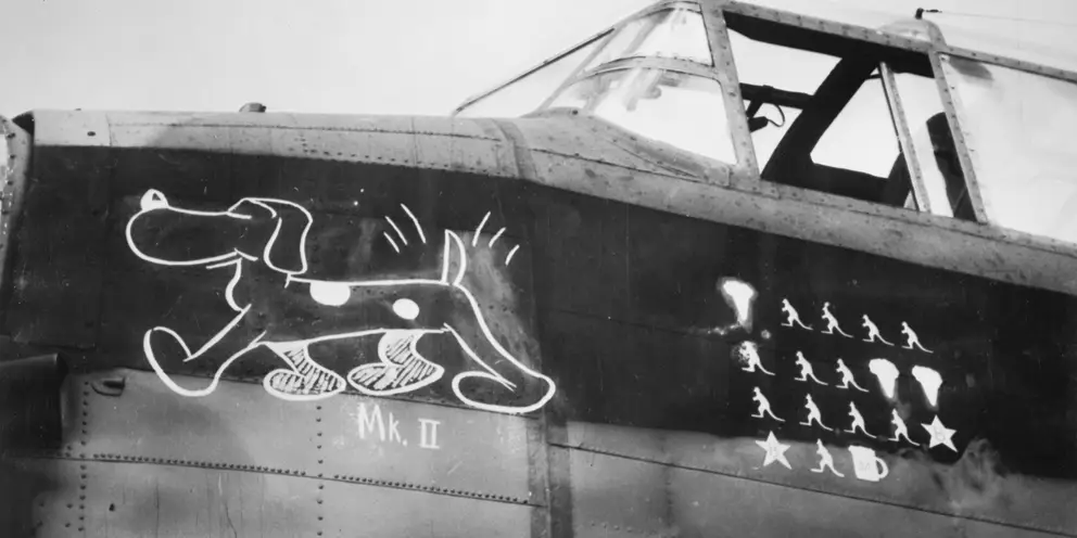 LINCOLNSHIRE, ENGLAND. 1943-09-08. "C" FOR COOEE, SHOWING SNIFFER (DOG) IS THE EMBLEM ON THIS LANCASTER AIRCRAFT OF NO. 460 SQUADRON RAAF OF BOMBER COMMAND BASED AT RAF STATION BINBROOK. THE NOSE ART APPLIED TO THE AIRCRAFT IS THE INFAMOUS AUSTRALIAN CARTOON DOG 'SNIFTER'. AWM UK00501