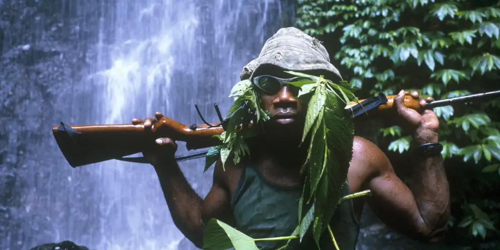 An Isatabu Freedom Movement (IFM) guerrilla on patrol on the Weather Coast, Guadalcanal, 2000.  Photo: Ben Bohane.  AWM P04580.059