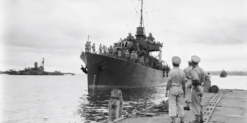 HMAS Diamantina pulling into the wharf