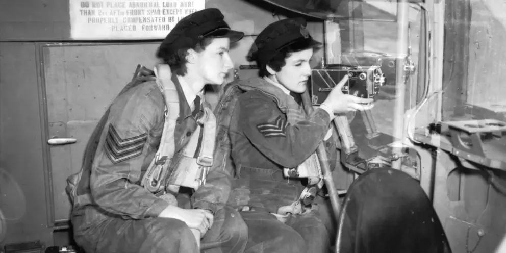 Sergeant Hilary Benn (right) testing her high speed aircraft camera watched by Sergeant Glen Morton