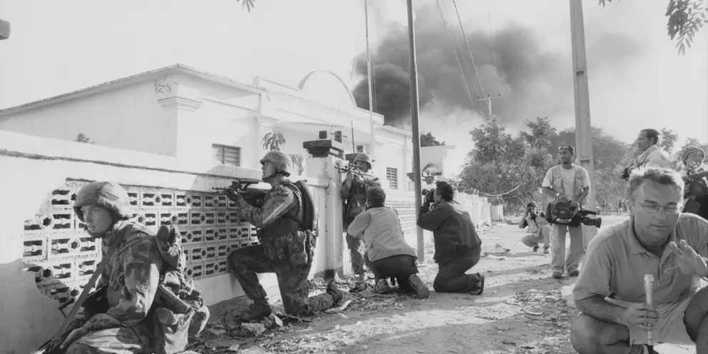 Members of the international media record an Australian patrol in Dili, September 1999.
