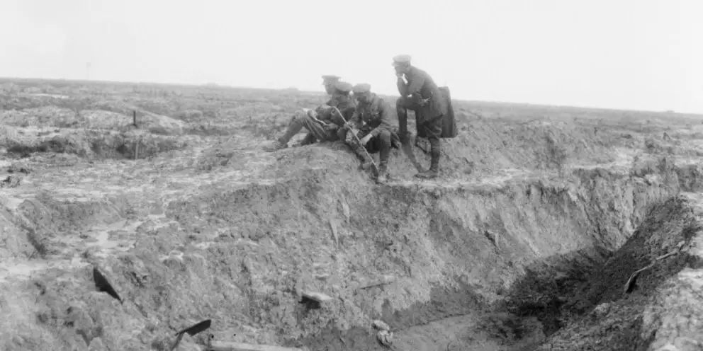 Official War Correspondent, C.E.W. Bean, with John Masefield, Will Dyson, and Alexis Aladin, going over the old battlefield at Pozieres.
