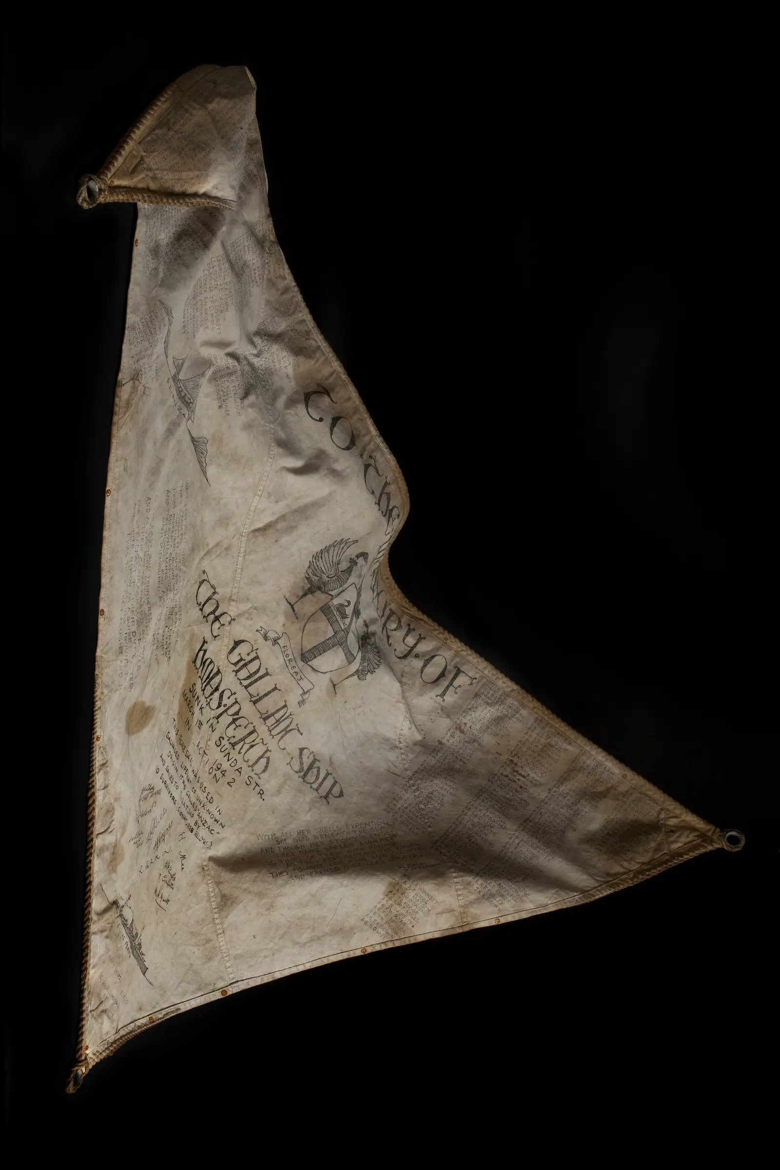The sail autographed and decorated by Perth survivors.