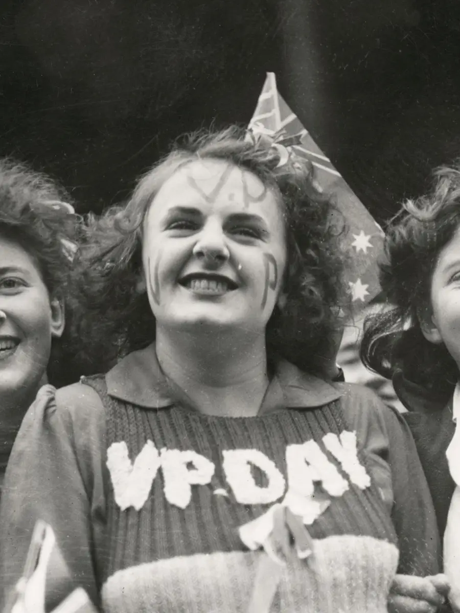 hotograph of three woman. One woman wearing a VP-Day knitted jumper.